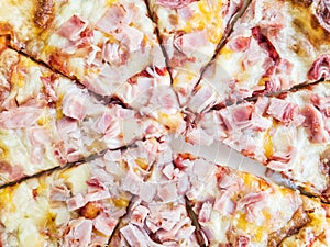 Baked tasty pizza with cheese and ham