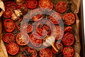 Baked tomatoes with garlic and spices for sauce. Appetizing photo