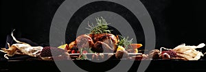 Baked turkey or chicken. The Christmas table is served with a turkey, decorated with fruits, salad and nuts. Fried chicken, table