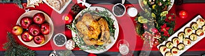 Baked turkey. Christmas dinner. The Christmas table is served with a turkey, decorated with bright tinsel and candles. Fried