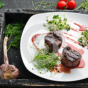 Baked veal in cranberry sauce. Veal medallions.