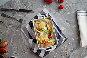 Baked vegetables with egg top view