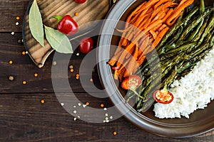 Baked vegetables (asparagus beans and carrot), boiled rice and rye croutons.