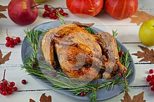 Baked whole chicken or turkey. Roasted homemade chicken with herbs. Thanksgiving day decoration
