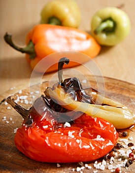 Baked whole pepper on a baking tray. Vegan food