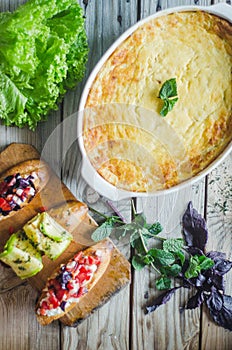 Baked zucchini and cheese soufle with italian bruschetta and herbs