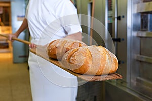 Baker baking bread showing the product