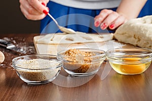 Baker brings dough into the desired shape