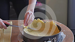 Baker forms pie crust ridges by hand