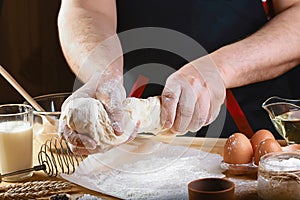 Baker knead dough bread, pizza or pie recipe ingredients with hands, food on kitchen table background, working with milk, yeast, f