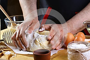 Baker knead dough bread, pizza or pie recipe ingredients with hands, food on kitchen table background, working with milk, yeast, f