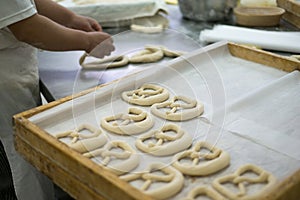 Baker Making Mirrored Pretzel