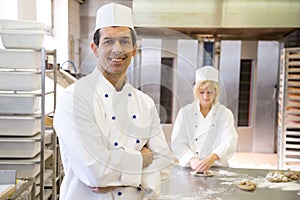 Baker posing in bakery or bakehouse