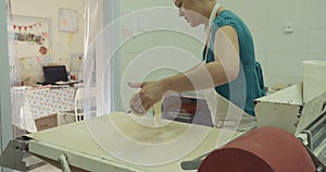 Baker preparing dough for cookies