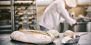 Baker preparing dough in industrial mixer