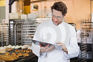 Baker reading something on clipboard