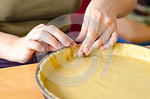 Baker shaping pie crust