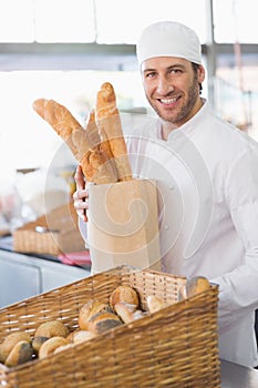 Baker showing basket of bread