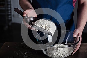 Baker sifting flour