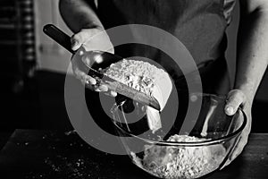 Baker sifting flour