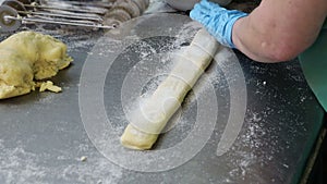 the baker works at the factory of products for the production of pastries pies cookies