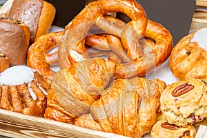 Bakery Bread on a Wooden Table. Various Bread and Sheaf of Wheat