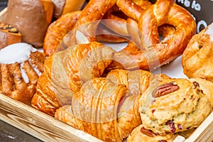 Bakery Bread on a Wooden Table. Various Bread and Sheaf of Wheat