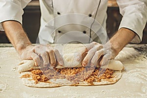 Bakery chef cooking bake in the kitchen professional