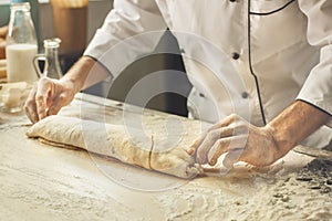 Bakery chef cooking bake in the kitchen professional