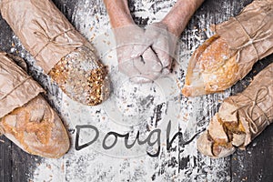 Bakery concept background. Hands and sorts of bread loaf