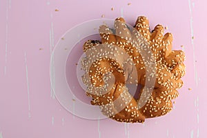 Bakery - gold rustic crusty loaves of bread and buns on textured background.