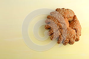 Bakery - gold rustic crusty loaves of bread and buns on textured background.