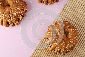 Bakery - gold rustic crusty loaves of bread and buns on textured background.