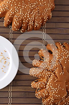 Bakery - gold rustic crusty loaves of bread and buns on textured background.