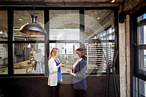 Bakery office with business women talking together