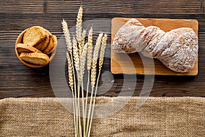 Bakery set with fresh wheaten bread on table rystic background top view