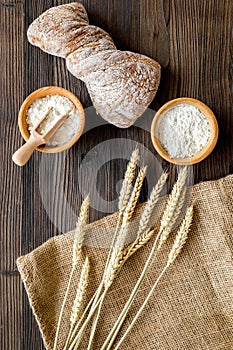 Bakery set with fresh wheaten bread on table rystic background top view
