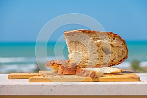 Bakery shop background with Pane Pugliese, a traditional bread of South Italy food tradition