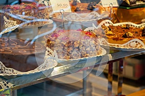 Bakery shop window with delicios cakes photo