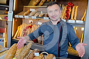 Bakery shopkeeper proud bread production