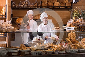 Bakery staff offering bread