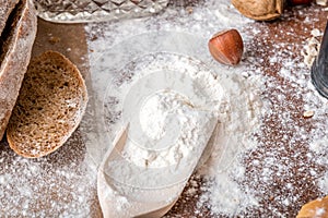 At the bakery, still life with bread, nuts and flour