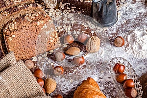 At the bakery, still life with bread, nuts and flour