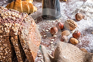 At the bakery, still life with bread, nuts and flour