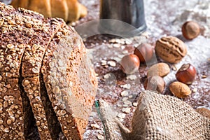 At the bakery, still life with bread, nuts and flour