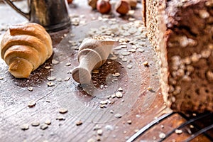 At the bakery, still life with mini Croissants, bread, milk, nuts and flour