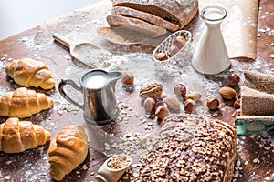 At the bakery, still life with mini Croissants, bread, milk, nuts and flour