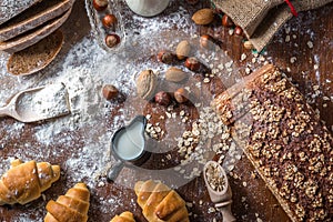 At the bakery, still life with mini Croissants, bread, milk, nuts and flour