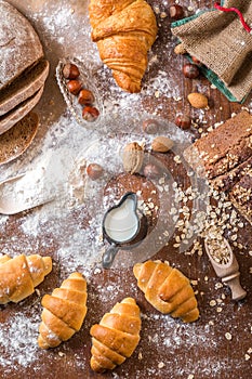 At the bakery, still life with mini Croissants, bread, milk, nuts and flour