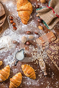 At the bakery, still life with mini Croissants, bread, milk, nuts and flour